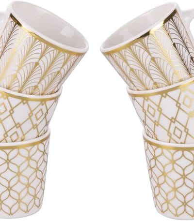 a stack of white and gold coffee cups